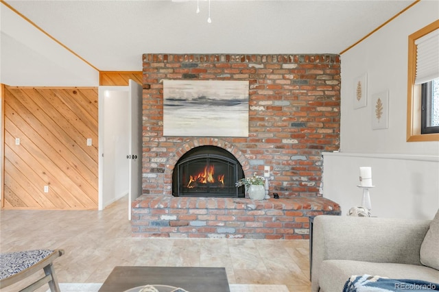 3260 Bit Rd, Evergreen, CO 80439 - living area with wood walls and a brick fireplace