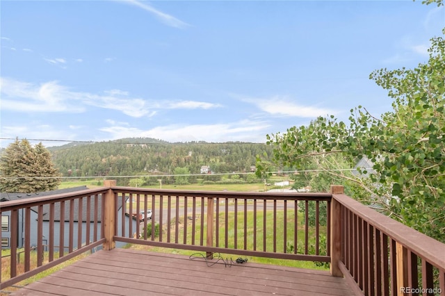 3260 Bit Rd, Evergreen, CO 80439 - wooden deck with a forest view