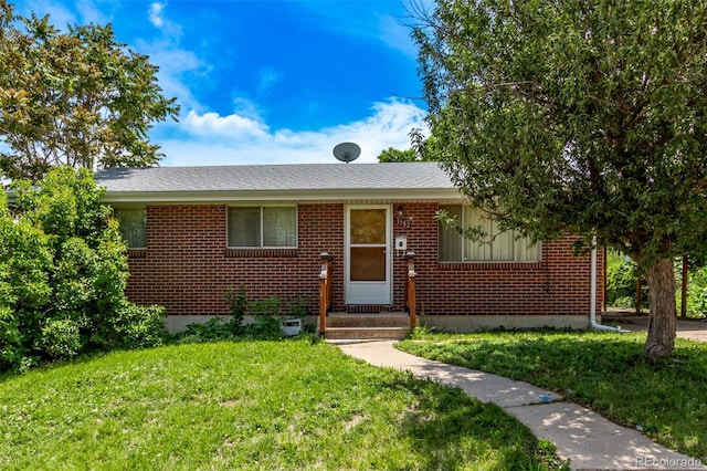 3182 W Radcliff Dr, Englewood, CO 80110 - view of front of property featuring brick siding and a front yard