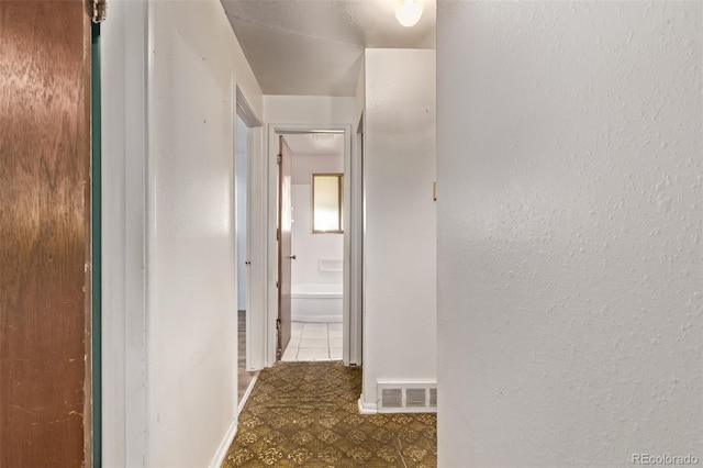 3182 W Radcliff Dr, Englewood, CO 80110 - corridor with tile patterned floors
