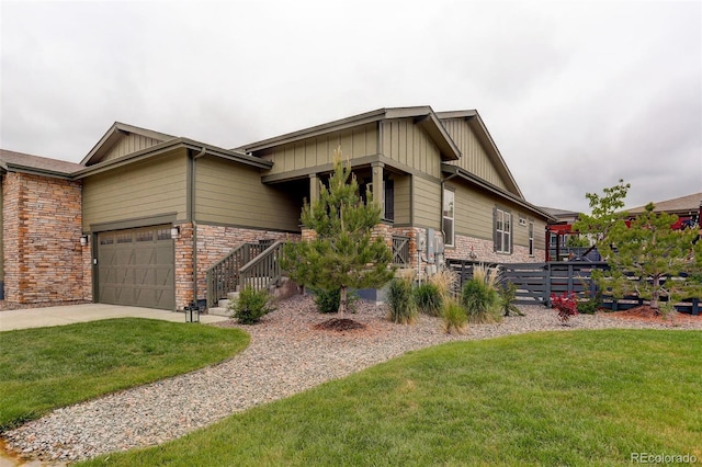 7029 Sagerock St, Castle Pines, CO 80108 - view of front of home featuring a front yard, board and batten siding, stone siding, and concrete driveway
