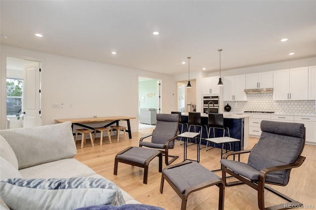 7029 Sagerock St, Castle Pines, CO 80108 - living area featuring recessed lighting and light wood finished floors