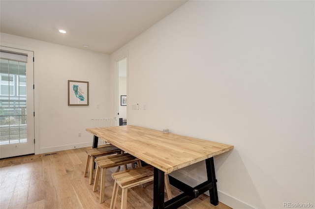 7029 Sagerock St, Castle Pines, CO 80108 - dining space featuring baseboards, light wood-type flooring, and recessed lighting