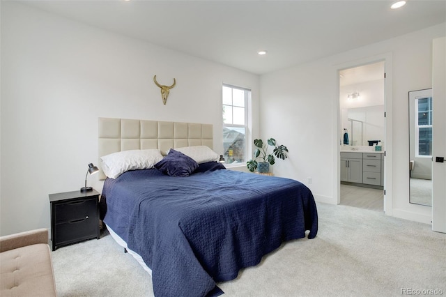 7029 Sagerock St, Castle Pines, CO 80108 - bedroom with light carpet, recessed lighting, connected bathroom, and baseboards