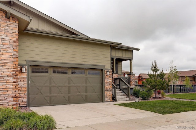 7029 Sagerock St, Castle Pines, CO 80108 - craftsman-style house with board and batten siding, concrete driveway, and a garage