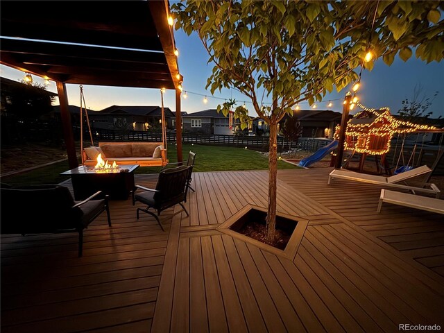 7029 Sagerock St, Castle Pines, CO 80108 - deck with an outdoor living space with a fire pit