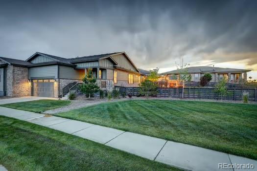7029 Sagerock St, Castle Pines, CO 80108 - view of yard featuring a garage and driveway