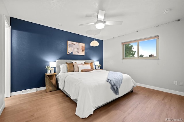 6742 Cole Cir, Arvada, CO 80004 - bedroom featuring light wood-style flooring and ceiling fan