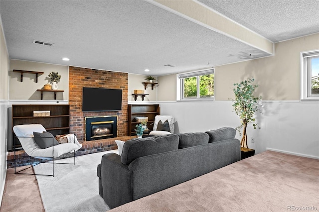 6742 Cole Cir, Arvada, CO 80004 - living area with a textured ceiling, carpet flooring, a fireplace, and recessed lighting