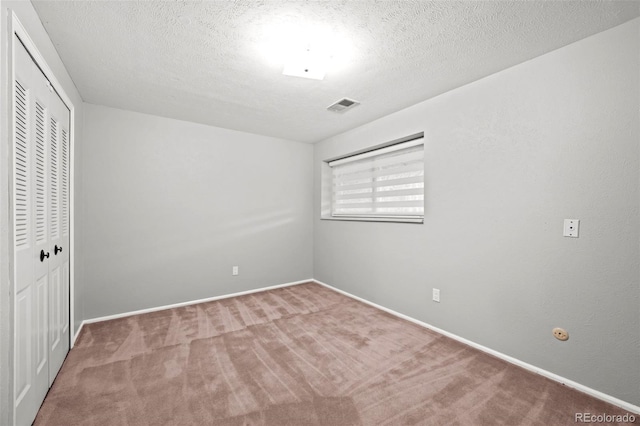 6742 Cole Cir, Arvada, CO 80004 - unfurnished bedroom with a closet, carpet, and a textured ceiling