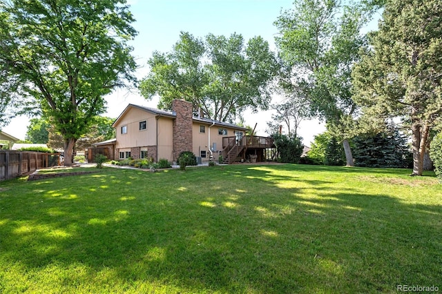 6742 Cole Cir, Arvada, CO 80004 - view of yard featuring stairs and a deck
