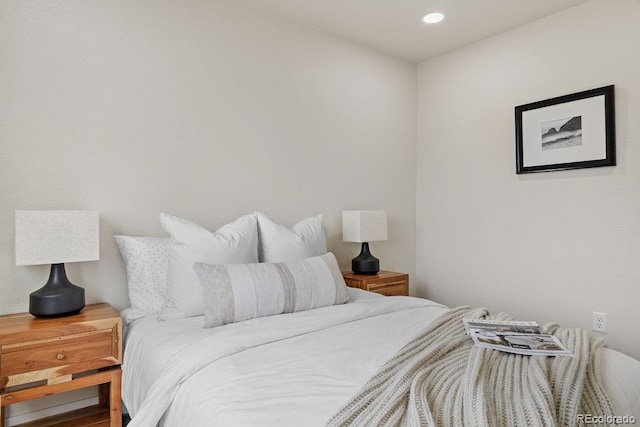 bedroom with hardwood / wood-style floors