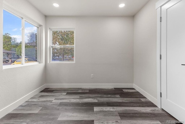 unfurnished room with hardwood / wood-style flooring