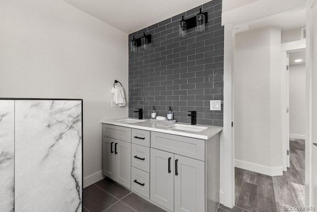 bathroom featuring vanity, decorative backsplash, and hardwood / wood-style floors