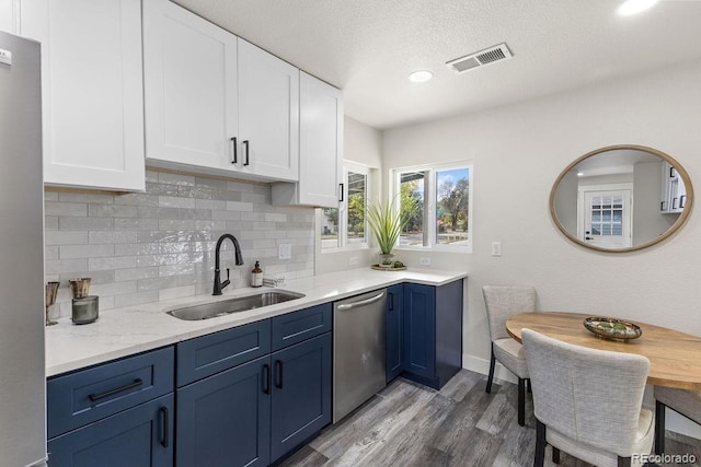 kitchen featuring sink, white cabinetry, and stainless steel appliances