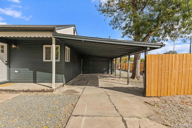 view of vehicle parking featuring a carport