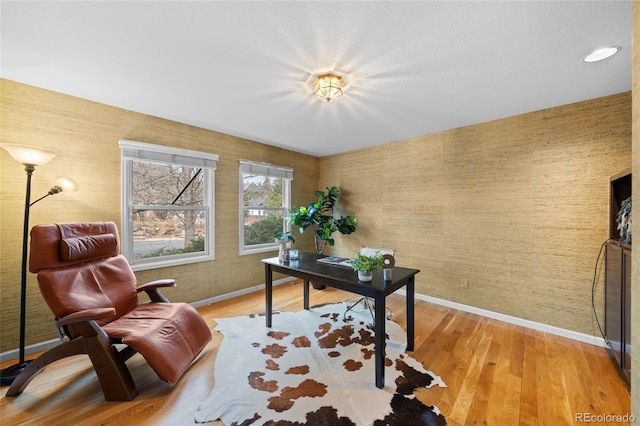 home office with hardwood / wood-style flooring