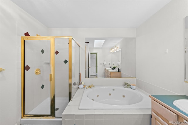 bathroom featuring vanity, separate shower and tub, and a skylight