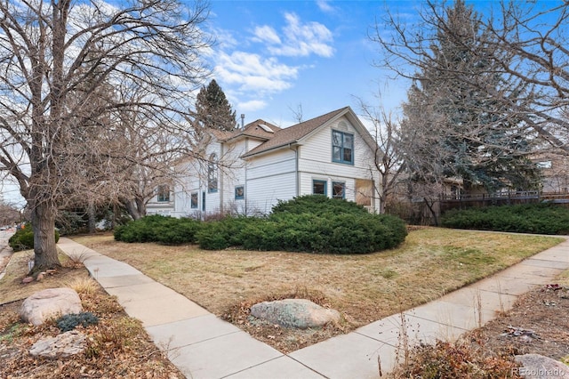 view of home's exterior with a yard