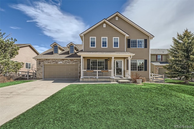 4206 Eagle Ridge Way, Castle Rock, CO 80104 - traditional-style house featuring a porch, a front yard, concrete driveway, an attached garage, and stone siding