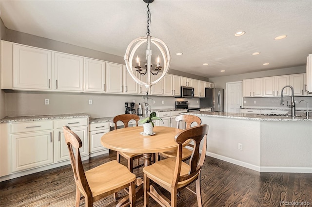 4206 Eagle Ridge Way, Castle Rock, CO 80104 - dining space featuring dark wood finished floors, a chandelier, recessed lighting, and baseboards