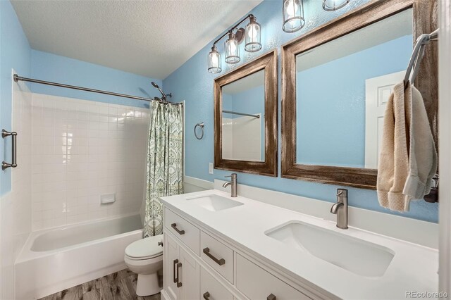 4206 Eagle Ridge Way, Castle Rock, CO 80104 - bathroom with shower / bath combo, double vanity, wood finished floors, toilet, and a textured ceiling