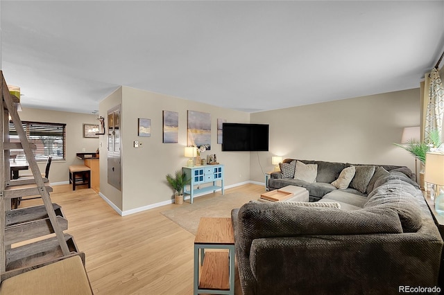 12286 W Tennessee, Lakewood, CO 80228 - living area with light wood-style flooring and baseboards