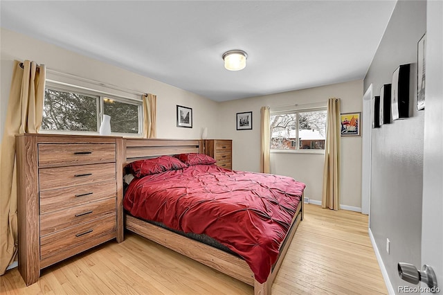 12286 W Tennessee, Lakewood, CO 80228 - bedroom with baseboards and light wood-type flooring