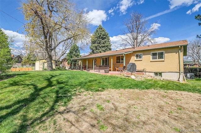 12286 W Tennessee, Lakewood, CO 80228 - back of house with a patio area and brick siding