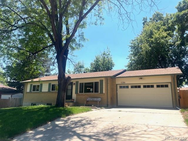 12286 W Tennessee, Lakewood, CO 80228 - single story home featuring concrete driveway and an attached garage