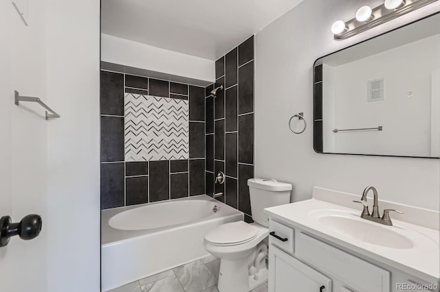 full bathroom featuring tiled shower / bath combo, toilet, and vanity