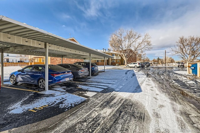 view of parking / parking lot featuring a carport