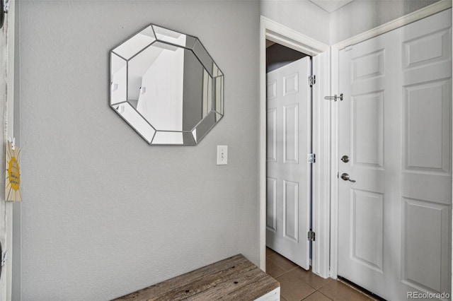 hall featuring tile patterned floors