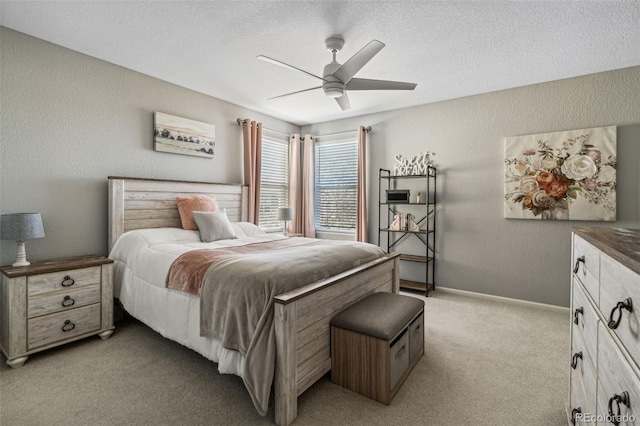 bedroom featuring light carpet and ceiling fan