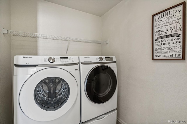 laundry room with washer and clothes dryer