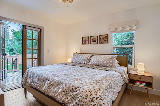 3219 S Washington St, Englewood, CO 80113 - bedroom with access to outside and wood-type flooring