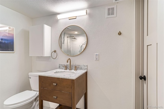 3219 S Washington St, Englewood, CO 80113 - bathroom featuring vanity, a textured ceiling, and a shower