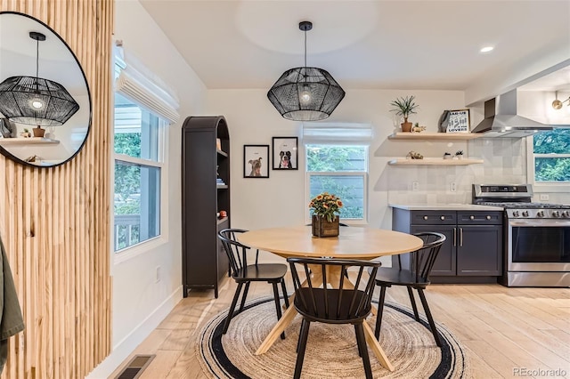 3219 S Washington St, Englewood, CO 80113 - dining space with light wood-style floors and recessed lighting