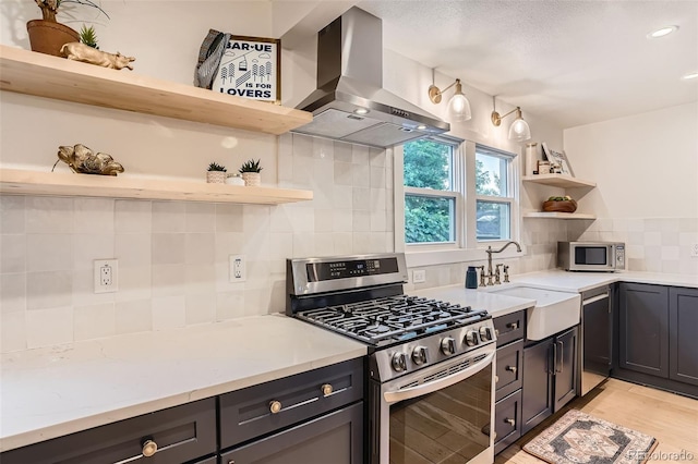 3219 S Washington St, Englewood, CO 80113 - kitchen featuring open shelves, stainless steel appliances, extractor fan, decorative backsplash, and recessed lighting