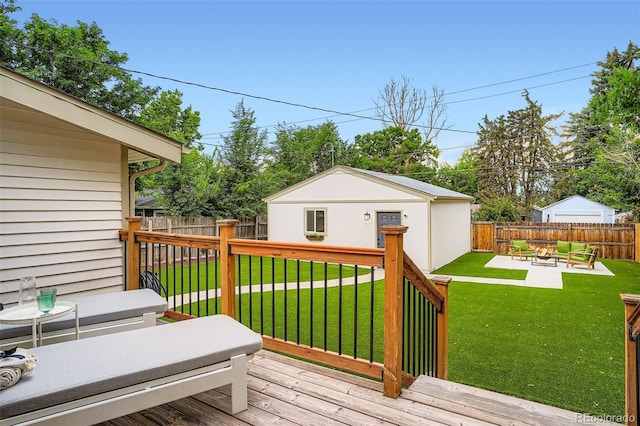 3219 S Washington St, Englewood, CO 80113 - deck featuring a fenced backyard, an outbuilding, and outdoor lounge area