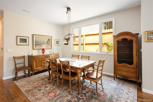 355 Steele St, Denver, CO 80206 - dining area with wood finished floors and baseboards