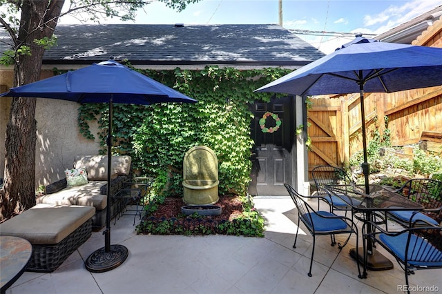 355 Steele St, Denver, CO 80206 - view of patio with outdoor dining space and a gate