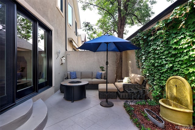 355 Steele St, Denver, CO 80206 - view of patio / terrace with an outdoor living space with a fire pit