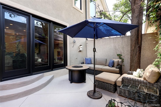 355 Steele St, Denver, CO 80206 - view of patio featuring an outdoor living space with a fire pit