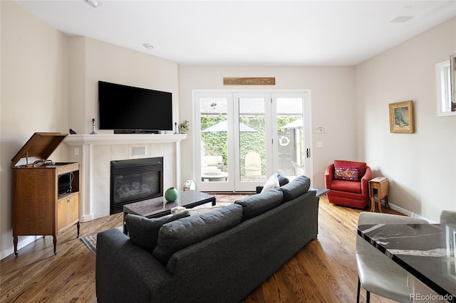355 Steele St, Denver, CO 80206 - living area featuring wood finished floors and a fireplace