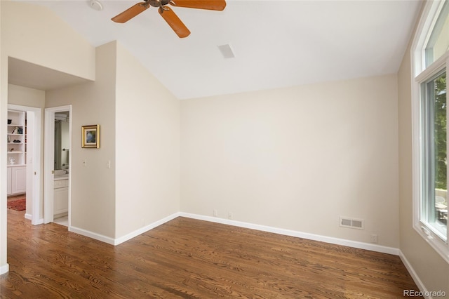 355 Steele St, Denver, CO 80206 - empty room with wood finished floors, vaulted ceiling, plenty of natural light, a ceiling fan, and baseboards