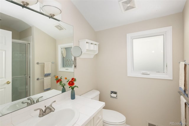 355 Steele St, Denver, CO 80206 - full bathroom featuring toilet, vanity, a shower with shower door, and vaulted ceiling