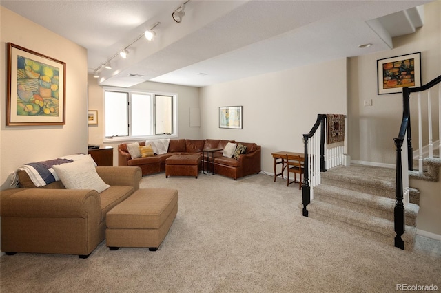 355 Steele St, Denver, CO 80206 - living area with carpet flooring, stairway, track lighting, and baseboards