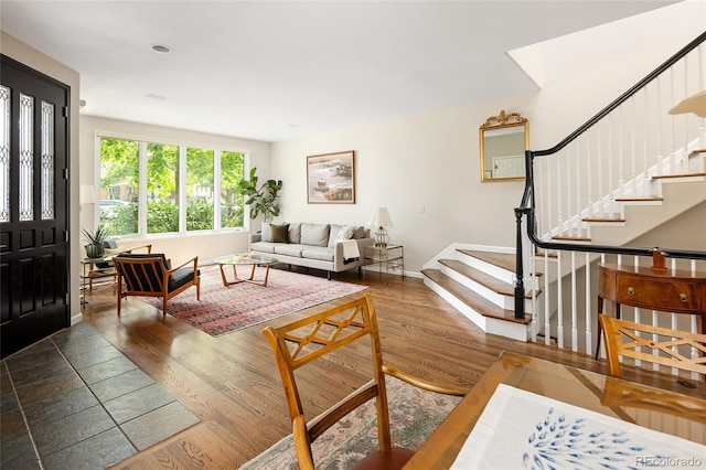 355 Steele St, Denver, CO 80206 - living room with stairway, wood finished floors, and baseboards