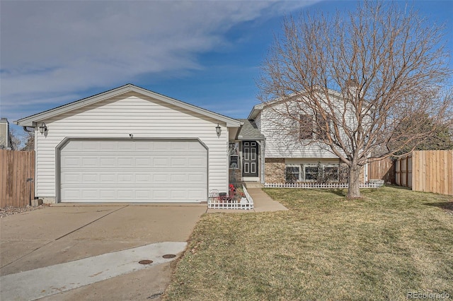 view of front of property with a garage and a front yard